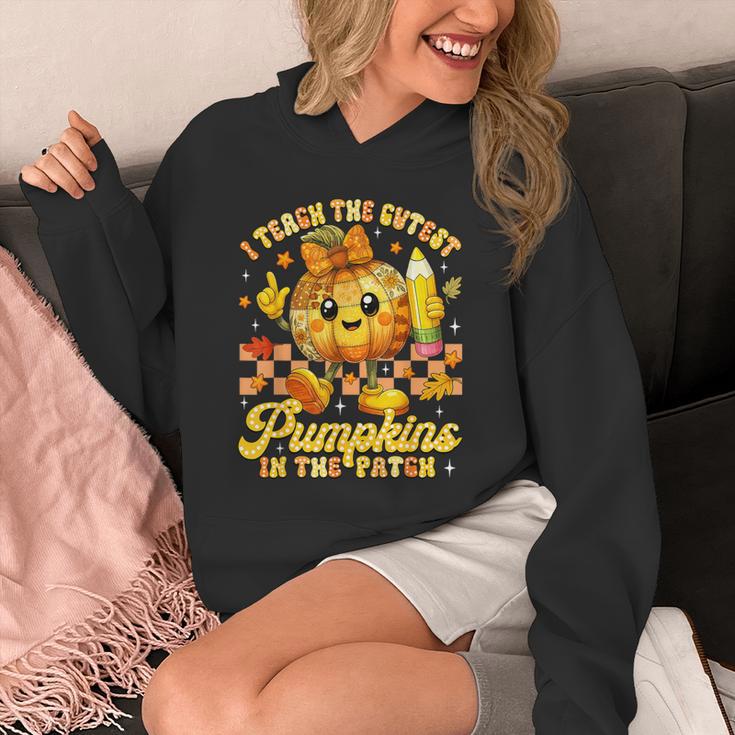 I Teach The Cutest Pumpkins In The Patch Teacher Halloween Unisex Hoodie, funny design
