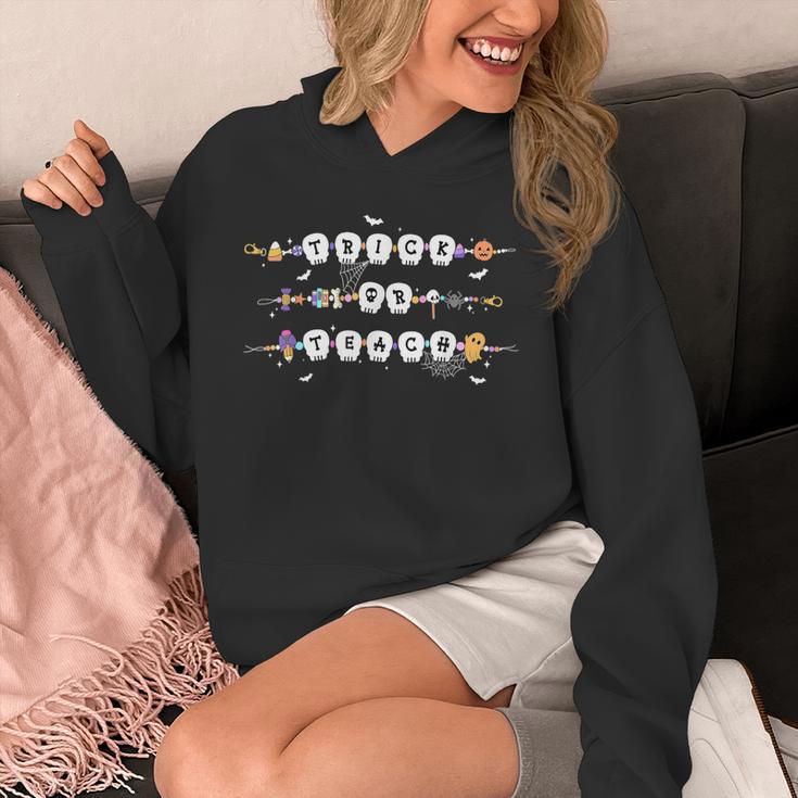 Trick Or Teach Spooky Teacher Happy Halloween Bracelet Unisex Hoodie, funny design Trick Or Teach Spooky Teacher Happy Halloween Bracelet Unisex Hoodie, funny design