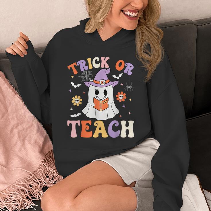 Trick Or Teach Teacher Groovy Ghost Halloween Teacher Unisex Hoodie, Groovy Teacher Gifts, funny design Trick Or Teach Teacher Groovy Ghost Halloween Teacher Unisex Hoodie, Groovy Teacher Gifts, funny design