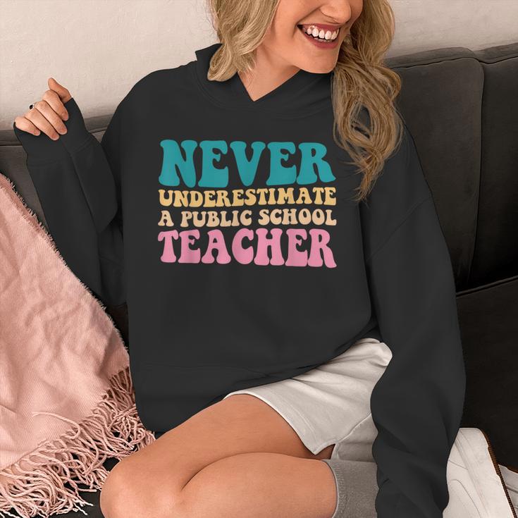 Never Underestimate A Public School Teacher Groovy Women Unisex Hoodie, Groovy Teacher Gifts, funny design Never Underestimate A Public School Teacher Groovy Women Unisex Hoodie, Groovy Teacher Gifts, funny design