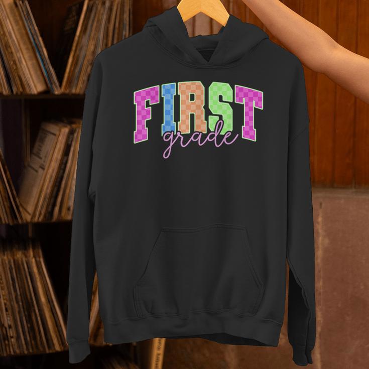 Back To School Neon Checkered First Grade Colorful Teacher Unisex Hoodie, First Grade Teacher Hoodies, gift for family, gift for coworker