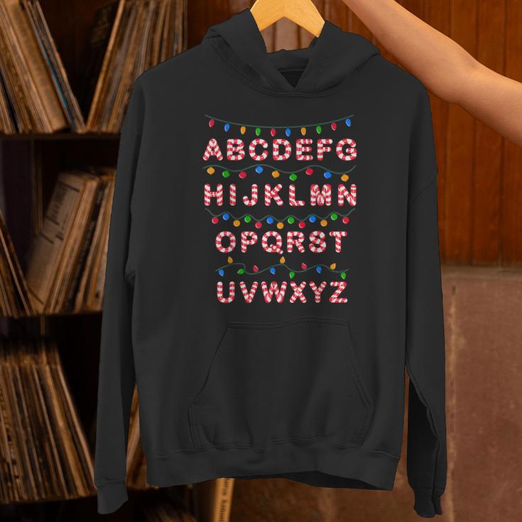Christmas Alphabet Candy Cane Teachers Students Candy Cane For Men Women Kids Unisex Hoodie, gift for family, gift for coworker Christmas Alphabet Candy Cane Teachers Students Candy Cane For Men Women Kids Unisex Hoodie, gift for family, gift for coworker