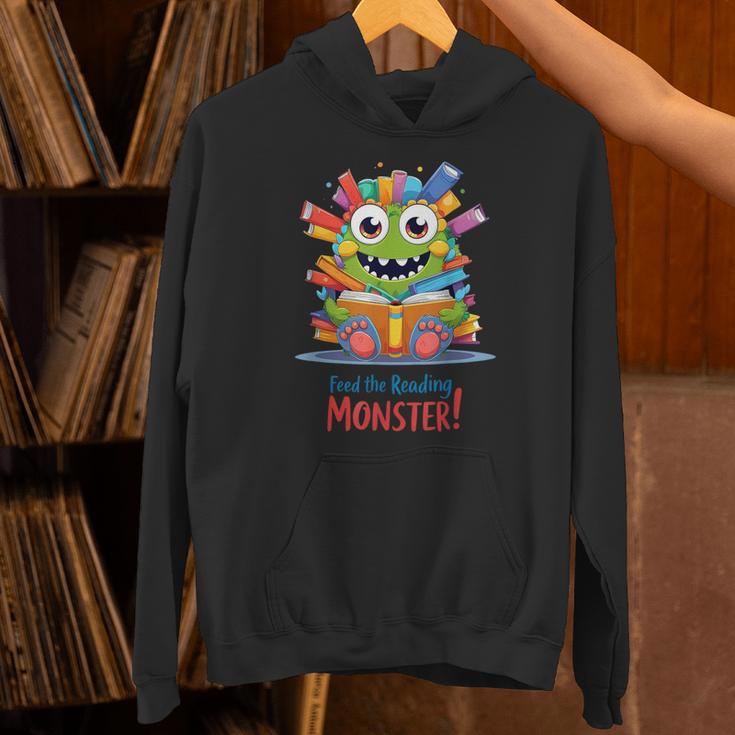 Feed The Reading Monster Halloween Teacher Unisex Hoodie, gift for family, gift for coworker Feed The Reading Monster Halloween Teacher Unisex Hoodie, gift for family, gift for coworker