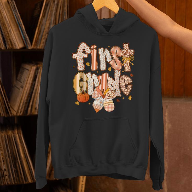 First Grade Fall Floral Coquette Bow Teachers Students Unisex Hoodie, First Grade Teacher Hoodies, gift for family, gift for coworker