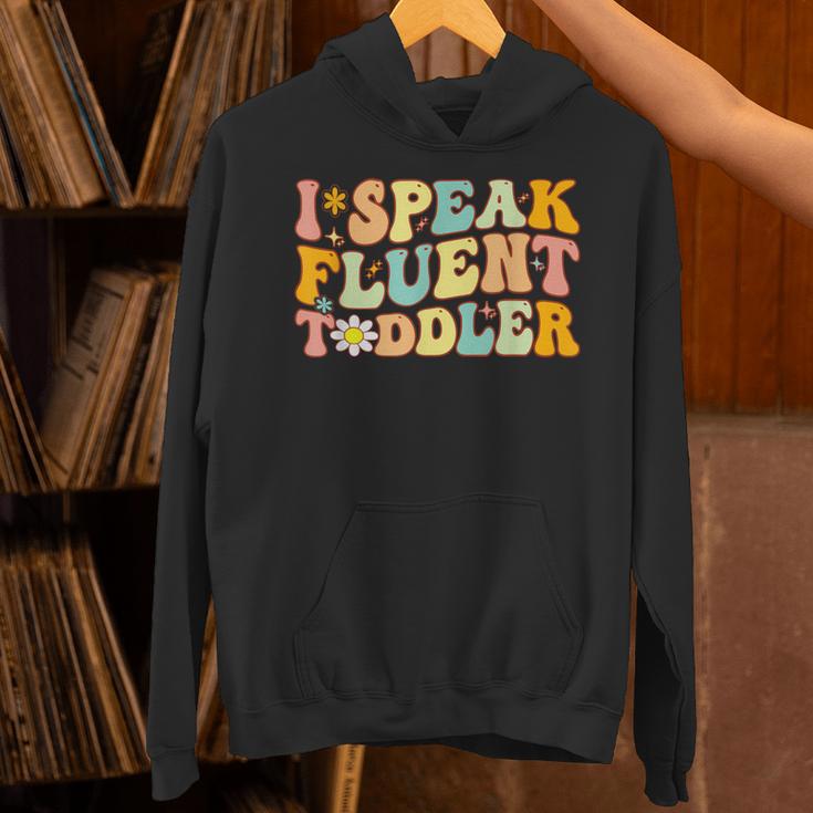 Groovy I Speak Fluent Toddler Daycare Provider Teacher Unisex Hoodie, Groovy Teacher Hoodies, gift for family, gift for coworker