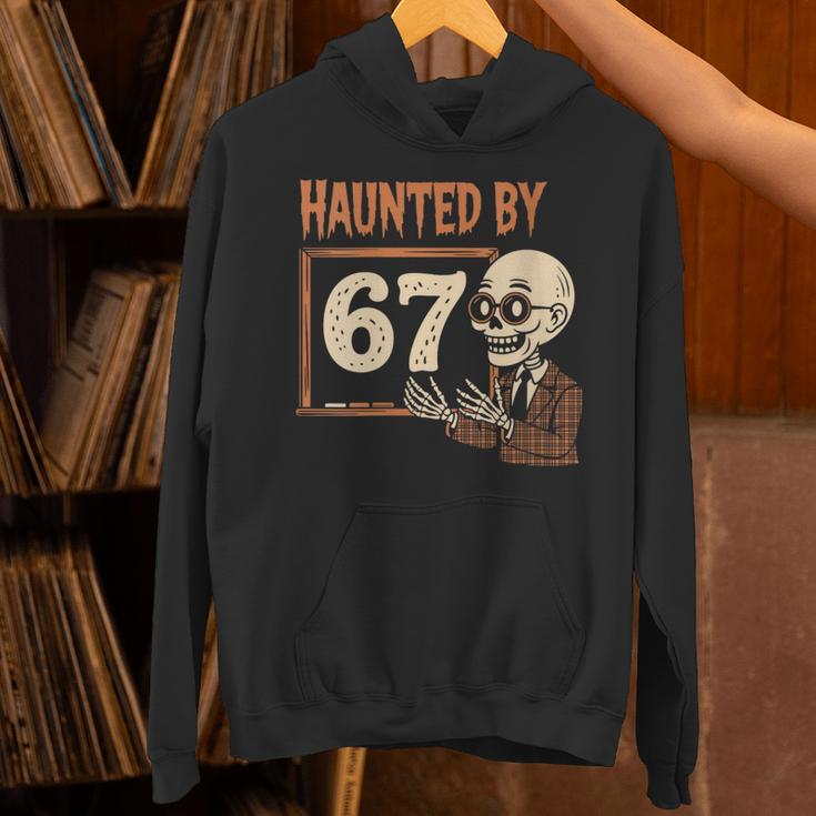 Haunted By 67 Halloween 67 Meme Six Seven Teacher Unisex Hoodie, gift for family, gift for coworker Haunted By 67 Halloween 67 Meme Six Seven Teacher Unisex Hoodie, gift for family, gift for coworker