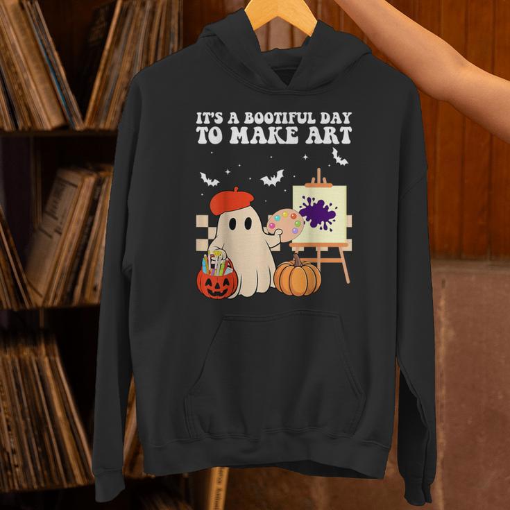 It's A Bootiful Day To Make Art Groovy Art Teacher Halloween Unisex Hoodie, Groovy Teacher Hoodies, gift for family, gift for coworker