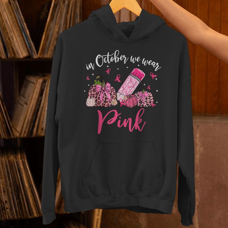 In October We Wear Pink Apple Teacher Daisy Breast Cancer Unisex Hoodie, gift for family, gift for coworker