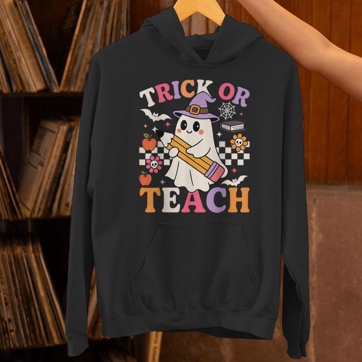 Retro Floral Ghost Trick Or Teach Groovy Teacher Halloween Unisex Hoodie, Groovy Teacher Hoodies, gift for family, gift for coworker Retro Floral Ghost Trick Or Teach Groovy Teacher Halloween Unisex Hoodie, Groovy Teacher Hoodies, gift for family, gift for coworker