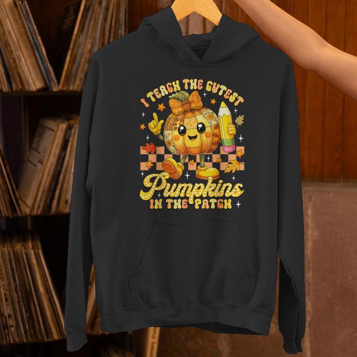 I Teach The Cutest Pumpkins In The Patch Teacher Halloween Unisex Hoodie, gift for family, gift for coworker