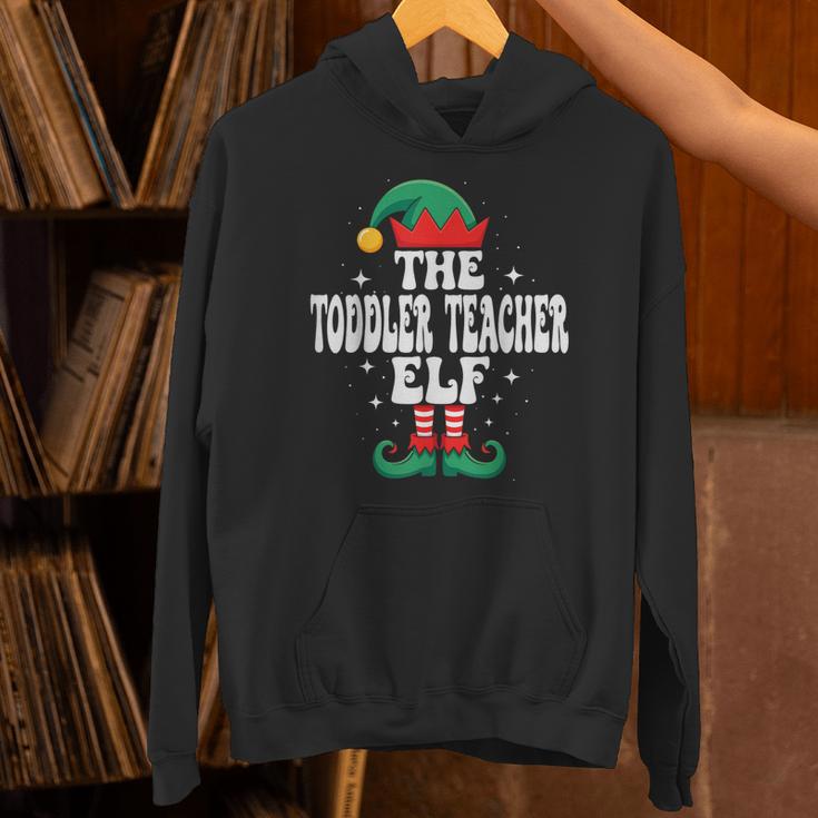 The Toddler Teacher Elf Christmas Matching Family Unisex Hoodie, gift for family, gift for coworker The Toddler Teacher Elf Christmas Matching Family Unisex Hoodie, gift for family, gift for coworker