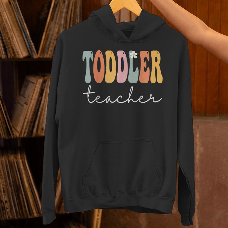 Toddler Teacher Retro Groovy Women Happy First Day Of School Unisex Hoodie, Groovy Teacher Hoodies, gift for family, gift for coworker Toddler Teacher Retro Groovy Women Happy First Day Of School Unisex Hoodie, Groovy Teacher Hoodies, gift for family, gift for coworker
