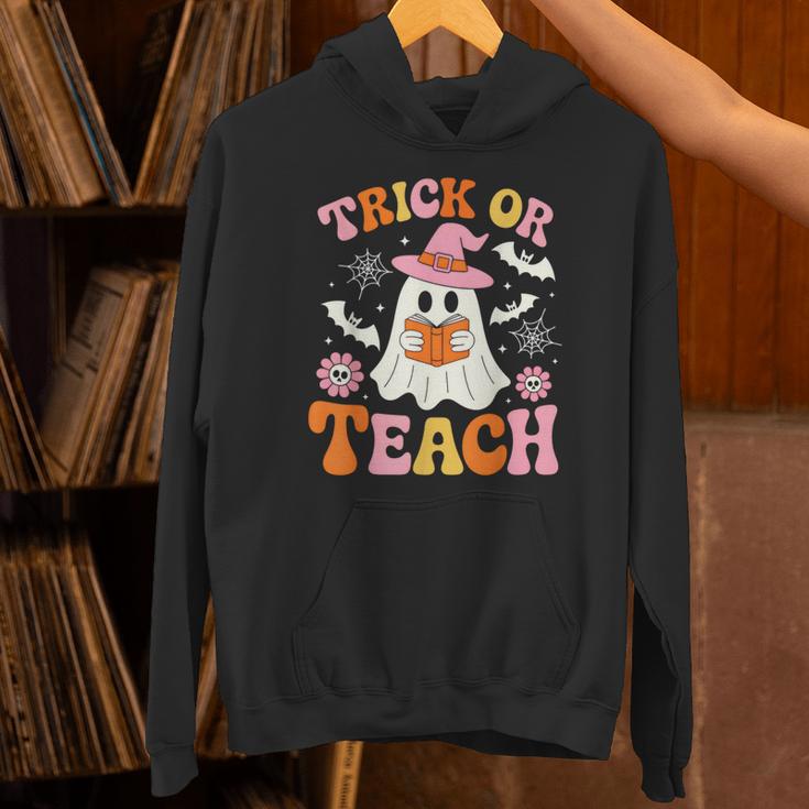 Trick Or Teach Cute Floral Ghost Teacher Halloween Costume Unisex Hoodie, gift for family, gift for coworker Trick Or Teach Cute Floral Ghost Teacher Halloween Costume Unisex Hoodie, gift for family, gift for coworker