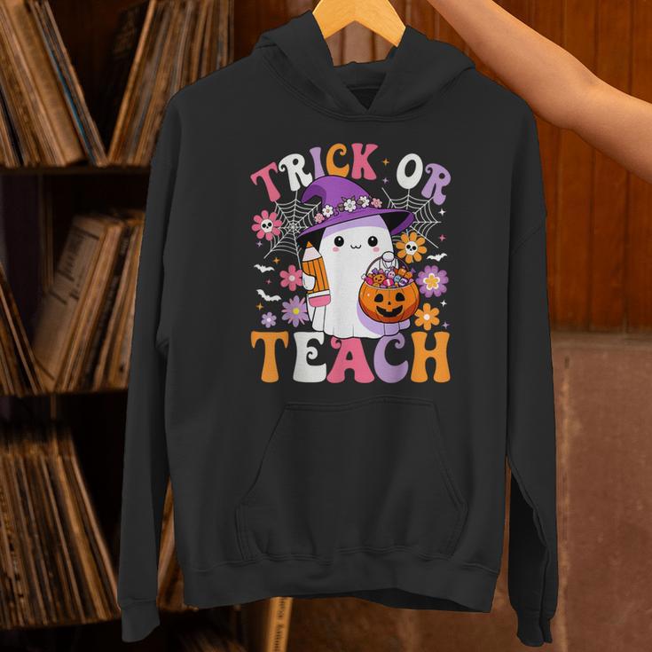 Trick Or Teach Groovy Teacher Ghost Halloween Teacher Unisex Hoodie, Groovy Teacher Hoodies, gift for family, gift for coworker