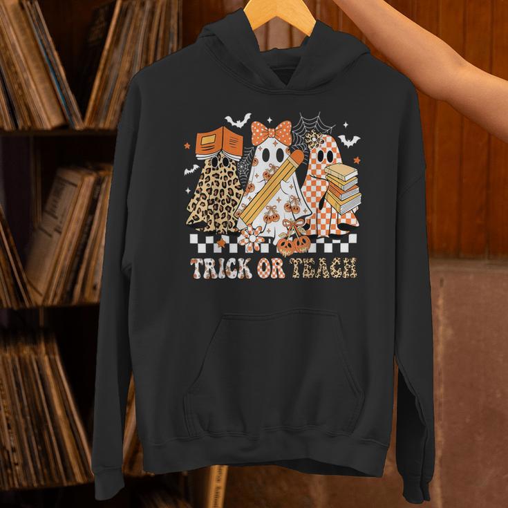 Trick Or Teach Groovy Teacher Halloween Floral Ghost Unisex Hoodie, Groovy Teacher Hoodies, gift for family, gift for coworker
