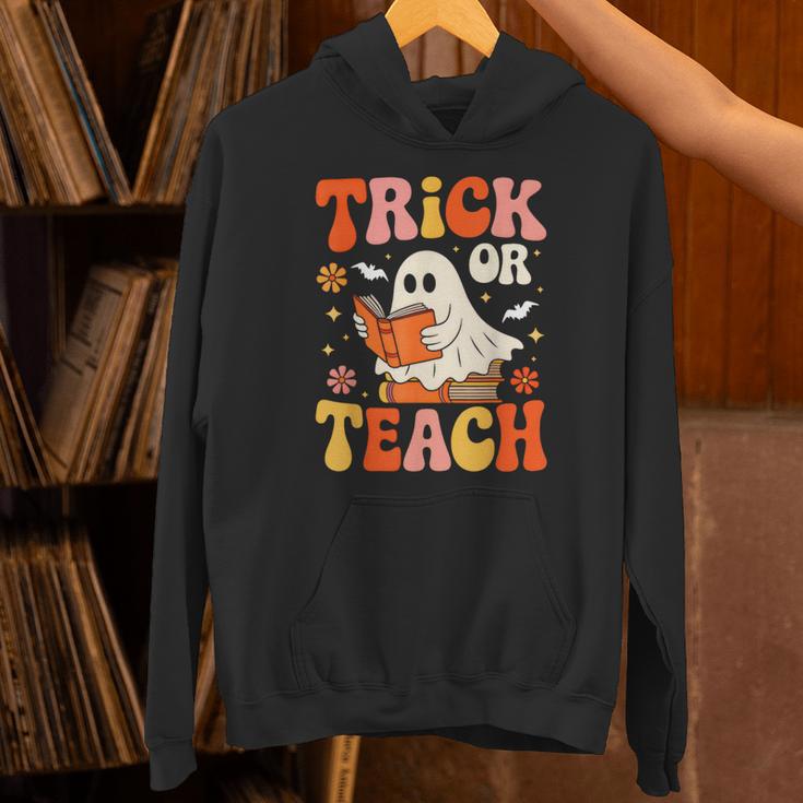 Trick Or Teach Halloween Shirt For Teacher Kids Floral Ghost Unisex Hoodie, gift for family, gift for coworker Trick Or Teach Halloween Shirt For Teacher Kids Floral Ghost Unisex Hoodie, gift for family, gift for coworker