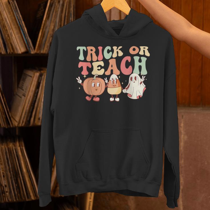 Trick Or Teach Pumpkin Candy Corn Ghost Halloween Teacher Unisex Hoodie, gift for family, gift for coworker Trick Or Teach Pumpkin Candy Corn Ghost Halloween Teacher Unisex Hoodie, gift for family, gift for coworker