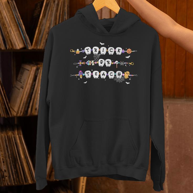 Trick Or Teach Spooky Teacher Happy Halloween Bracelet Unisex Hoodie, gift for family, gift for coworker Trick Or Teach Spooky Teacher Happy Halloween Bracelet Unisex Hoodie, gift for family, gift for coworker