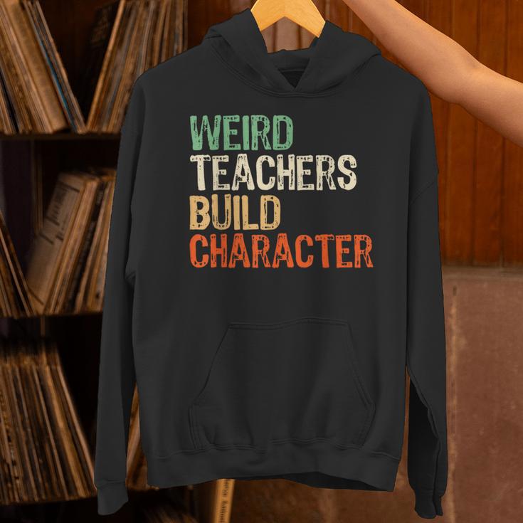 Weird Teachers Build Character Teacher Appreciation Week Day Unisex Hoodie, gift for family, gift for coworker