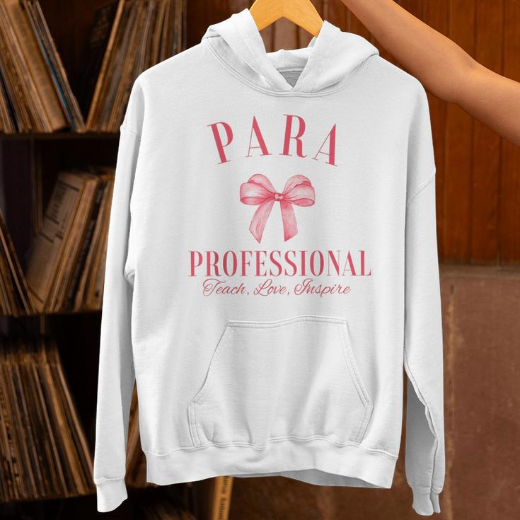 Coquette Bow Paraprofessional School Para Squad Teacher Aide Unisex Hoodie, gift for family, gift for coworker Coquette Bow Paraprofessional School Para Squad Teacher Aide Unisex Hoodie, gift for family, gift for coworker