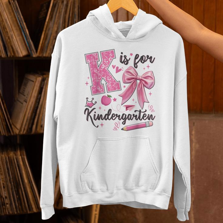 K Is For Kindergarten Teacher Coquette Bow Back To School Unisex Hoodie, gift for family, gift for coworker K Is For Kindergarten Teacher Coquette Bow Back To School Unisex Hoodie, gift for family, gift for coworker