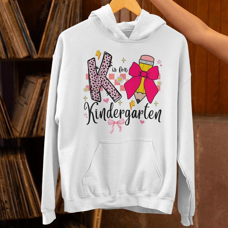 K Is For Kindergarten Teacher Coquette Bow Back To School Unisex Hoodie, gift for family, gift for coworker K Is For Kindergarten Teacher Coquette Bow Back To School Unisex Hoodie, gift for family, gift for coworker