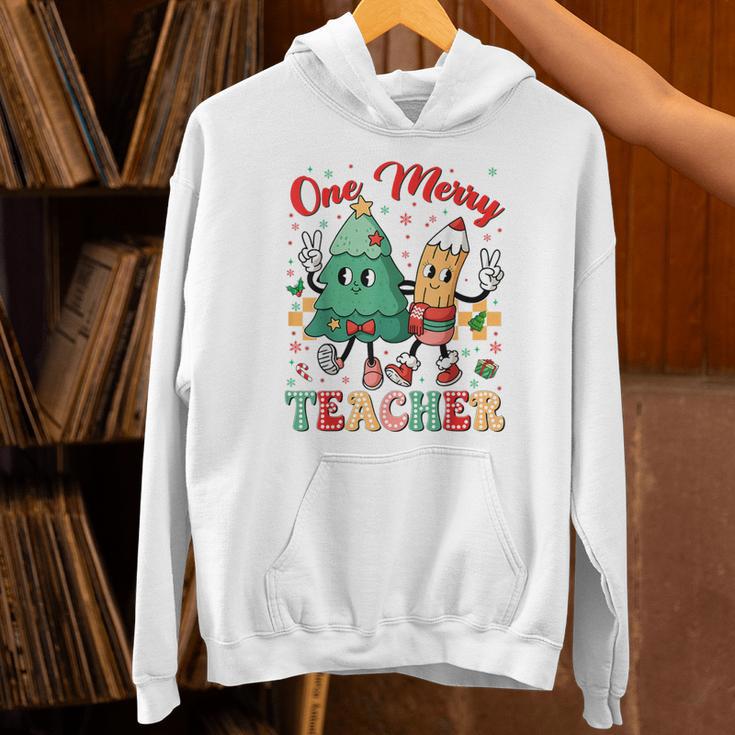 One Merry Teacher Groovy Christmas Tree Pjs Xmas Teacher Unisex Hoodie, Groovy Teacher Hoodies, gift for family, gift for coworker One Merry Teacher Groovy Christmas Tree Pjs Xmas Teacher Unisex Hoodie, Groovy Teacher Hoodies, gift for family, gift for coworker