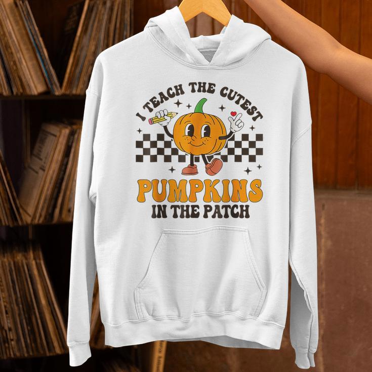 I Teach The Cutest Pumpkins In The Patch Groovy Teacher Fall Unisex Hoodie, Groovy Teacher Hoodies, gift for family, gift for coworker