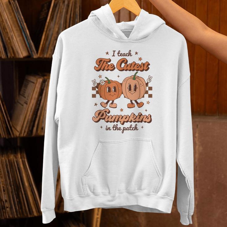 I Teach The Cutest Pumpkins In The Patch Retro Teacher Fall Unisex Hoodie, gift for family, gift for coworker I Teach The Cutest Pumpkins In The Patch Retro Teacher Fall Unisex Hoodie, gift for family, gift for coworker