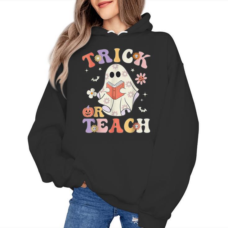 Groovy Halloween Trick Or Teach Retro Floral Ghost Teacher Women's Hoodie, Groovy Teacher Gifts, trending gift Groovy Halloween Trick Or Teach Retro Floral Ghost Teacher Women's Hoodie, Groovy Teacher Gifts, trending gift