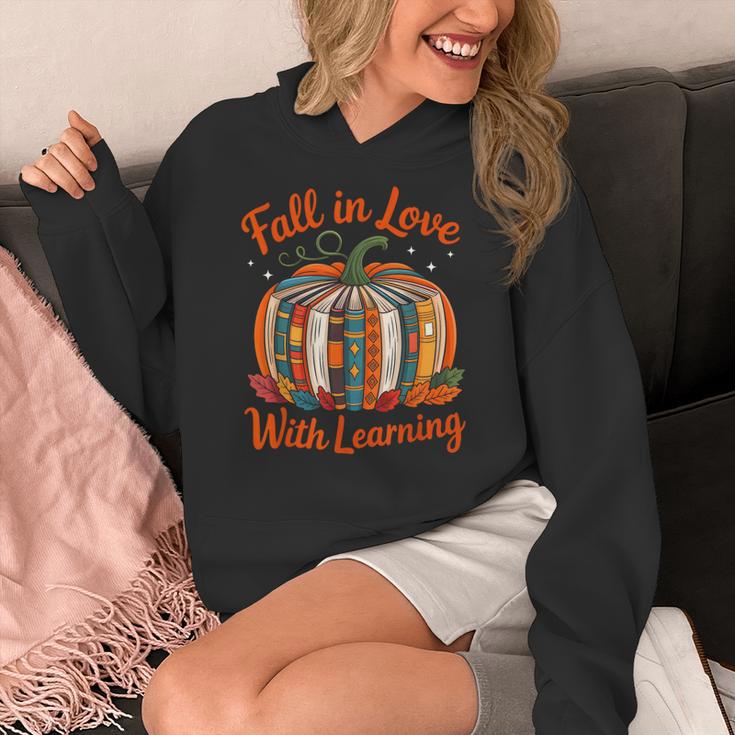 Fall In Love With Learning Book Lover Autumn Pumpkin Teacher Women's Hoodie, funny design