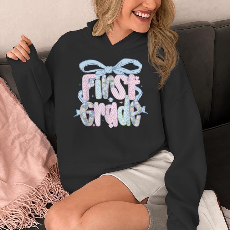 First Grade Coquette Bow Girls Teacher Team 1st Grade Squad Women's Hoodie, First Grade Teacher Gifts, funny design