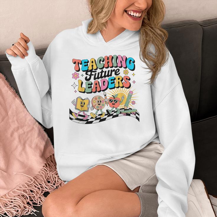 Retro Teaching Future Leaders Groovy Teacher Back To School Women's Hoodie, Future Teacher Gifts, Groovy Teacher Gifts, funny design
