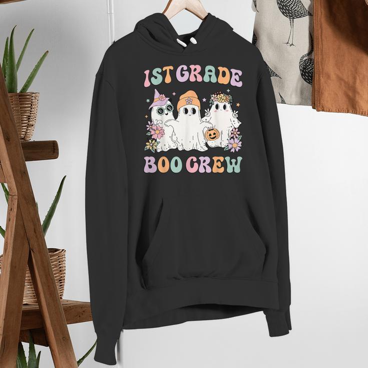 1st Grade Boo Crew Groovy Halloween Floral Ghost Kid Teacher Women's Hoodie, Groovy Teacher Hoodies, funny gift
