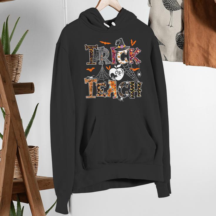 Fall Holiday Themed Thanksgiving Halloween Teacher Trick Or Women's Hoodie, funny gift