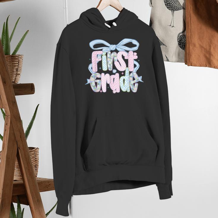 First Grade Coquette Bow Girls Teacher Team 1st Grade Squad Women's Hoodie, First Grade Teacher Hoodies, funny gift
