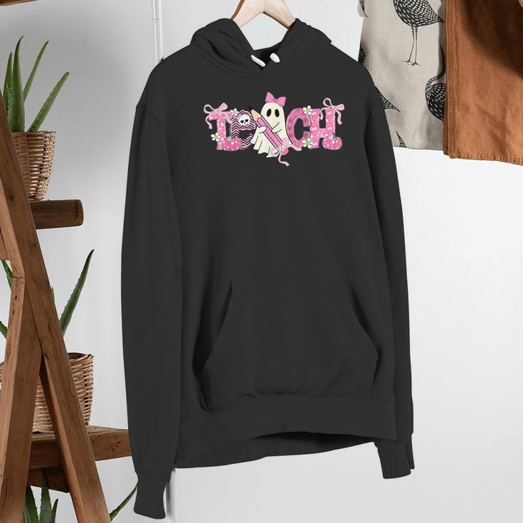 Pink Ghost Teach Halloween Teacher In Spooky Season Women's Hoodie, funny gift Pink Ghost Teach Halloween Teacher In Spooky Season Women's Hoodie, funny gift