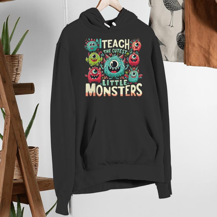 I Teach The Cutest Little Monsters Teacher Halloween Outfit Women's Hoodie, funny gift