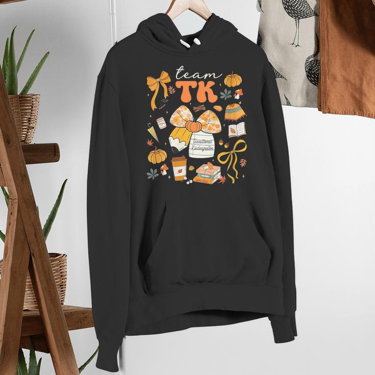 Team TK Crew Preppy Coquette Bow Pumpkin Fall TK Teacher Women's Hoodie, funny gift