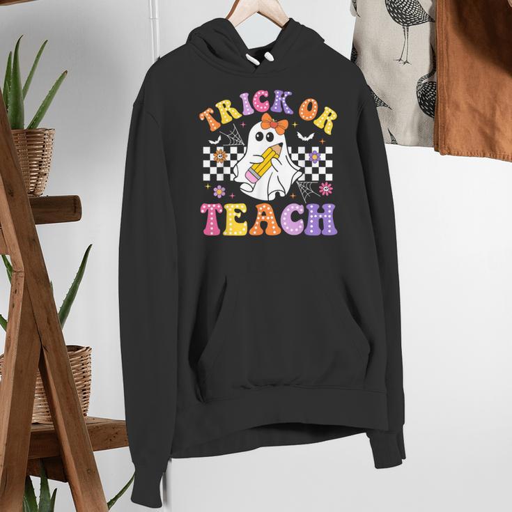 Trick Or Teach Groovy Halloween Teachers Women's Hoodie, funny gift Trick Or Teach Groovy Halloween Teachers Women's Hoodie, funny gift