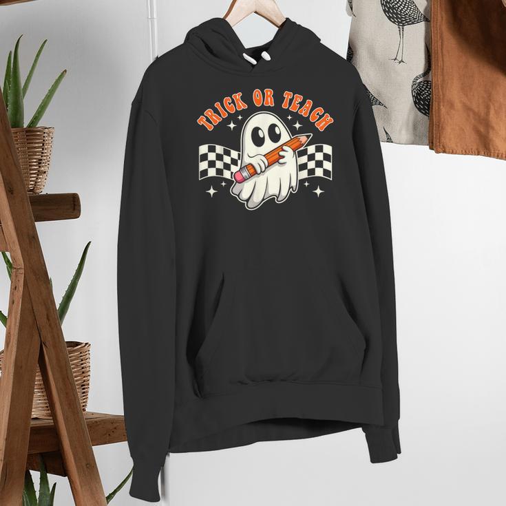Trick Or Teach Groovy Retro Ghost Halloween Teacher Kids Women's Hoodie, Groovy Teacher Hoodies, funny gift