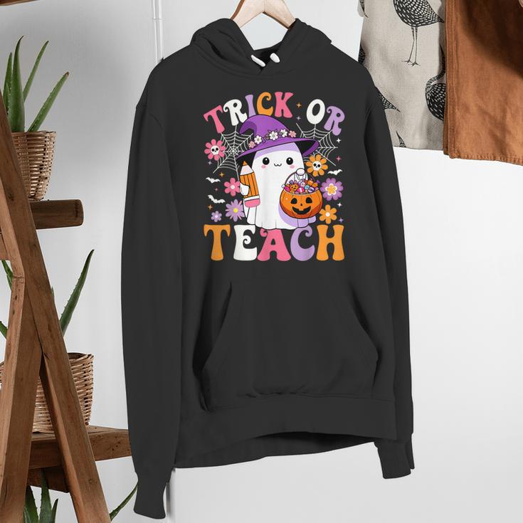 Trick Or Teach Groovy Teacher Ghost Halloween Teacher Women's Hoodie, Groovy Teacher Hoodies, funny gift Trick Or Teach Groovy Teacher Ghost Halloween Teacher Women's Hoodie, Groovy Teacher Hoodies, funny gift