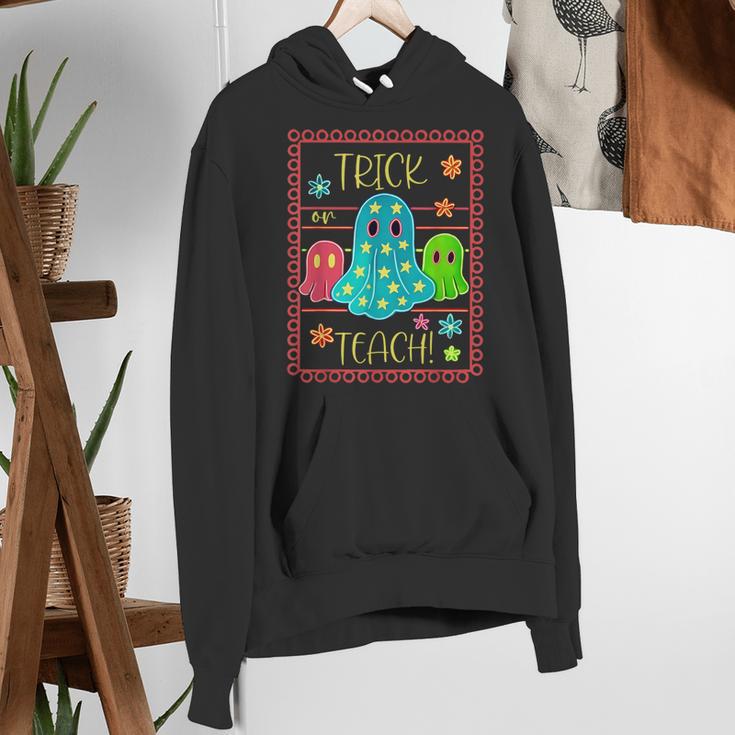 Trick Or Teach Neon Ghost Flower Teacher Spooky Halloween Women's Hoodie, funny gift