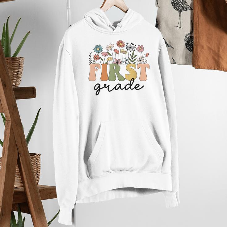 First Grade Teacher Wildflower Back To School Floral Outfits Women's Hoodie, First Grade Teacher Hoodies, funny gift