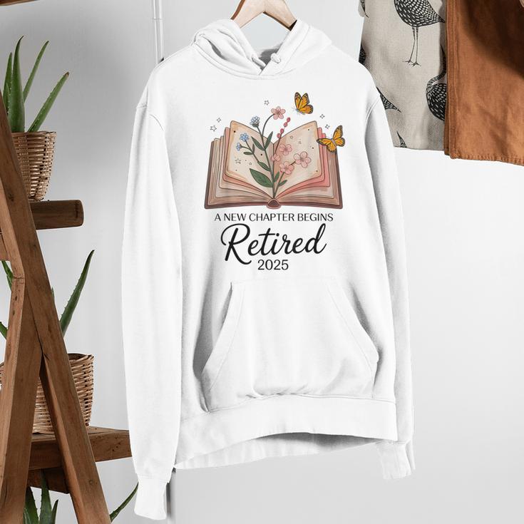 Retired 2025 A New Chapter Begins Retirement Teacher Book Women's Hoodie, funny gift