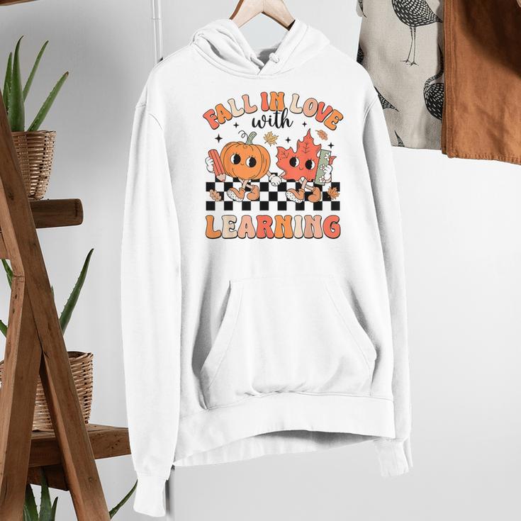 Retro Fall In Love With Learning Autumn Pumpkin Teacher Women's Hoodie, funny gift