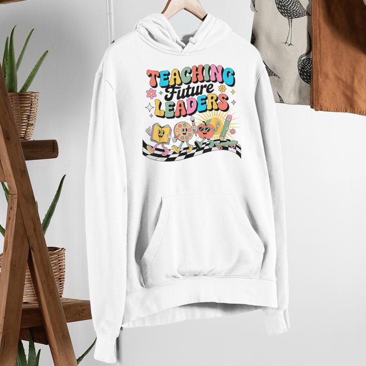 Retro Teaching Future Leaders Groovy Teacher Back To School Women's Hoodie, Future Teacher Hoodies, Groovy Teacher Hoodies, funny gift