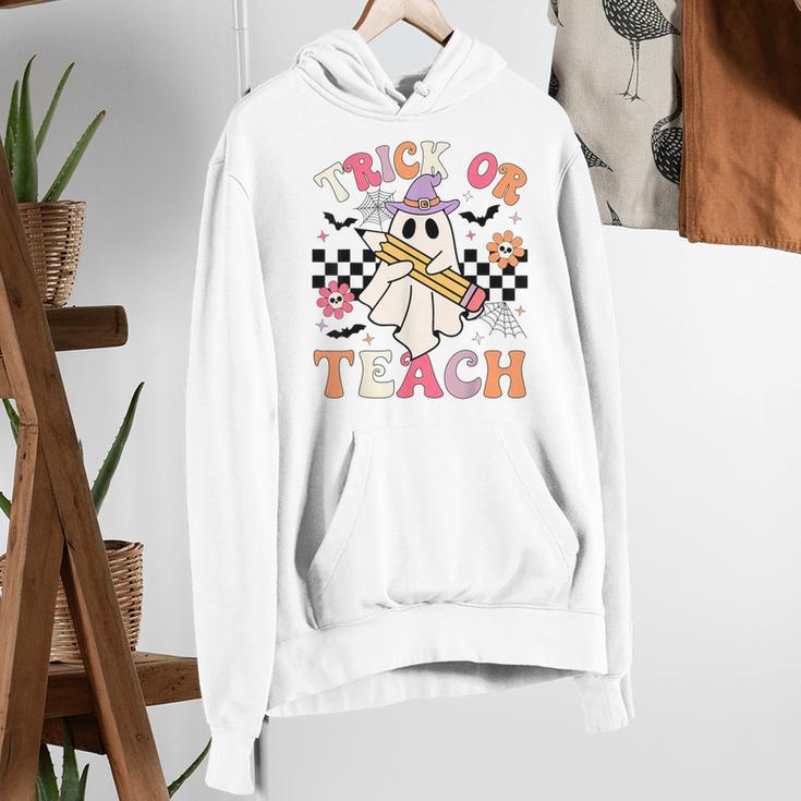 Trick Or Teach Groovy Teacher Halloween Retro Floral Ghost Women's Hoodie, Groovy Teacher Hoodies, funny gift Trick Or Teach Groovy Teacher Halloween Retro Floral Ghost Women's Hoodie, Groovy Teacher Hoodies, funny gift