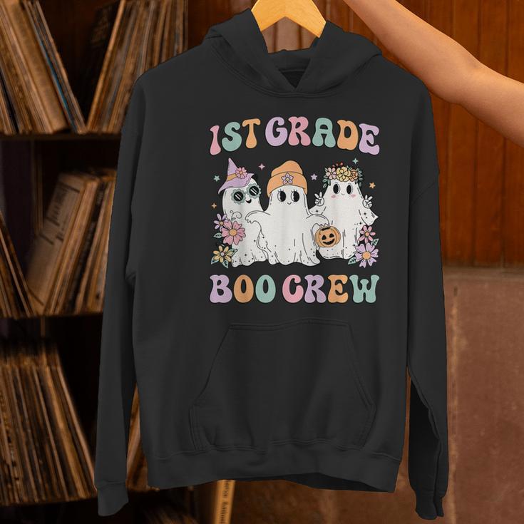 1st Grade Boo Crew Groovy Halloween Floral Ghost Kid Teacher Women's Hoodie, Groovy Teacher Hoodies, gift for family, gift for coworker