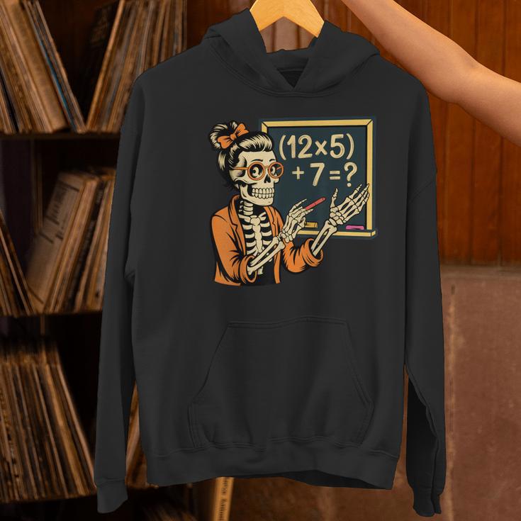 67 Teacher Halloween Skeleton Women's Hoodie, gift for family, gift for coworker